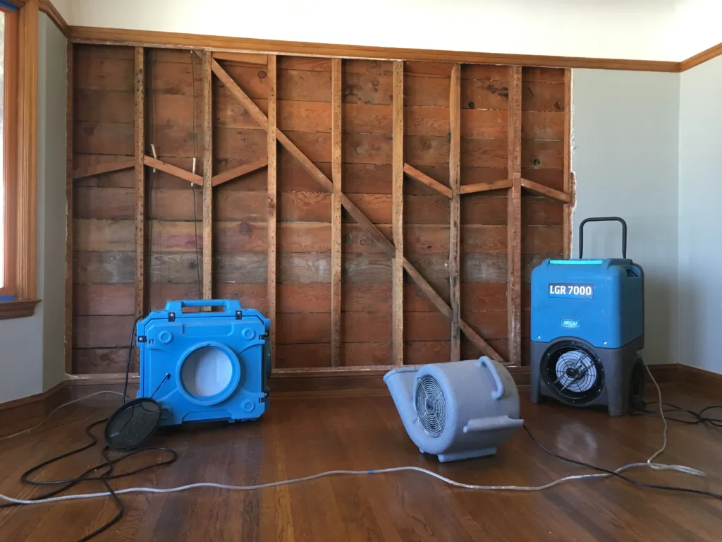 Industrial LGR 7000 dehumidifier and air movers set up for professional mold remediation and structural drying